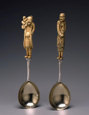 Netsuke: serving spoon with netsuke attached as handle, Chinese man holding child