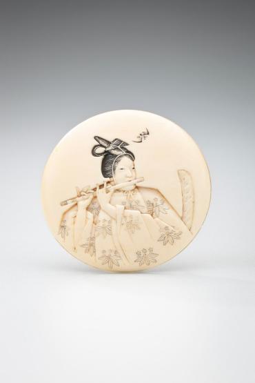 Netsuke: young nobleman playing a flute