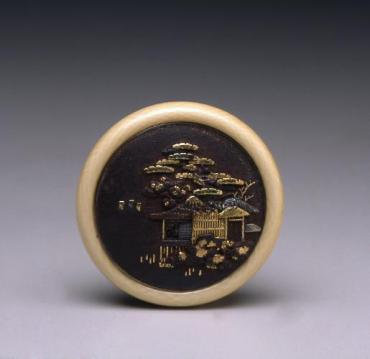 Netsuke: kagamibuta with landscape