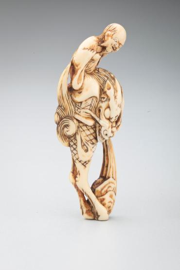 Netsuke: Sage riding a Kirin