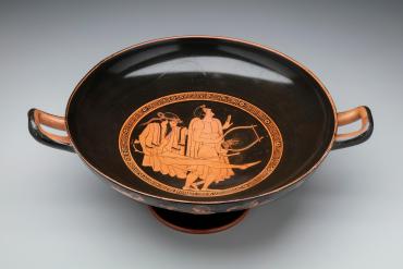 Kylix (drinking cup); Inside: Two Revelers;  Outside: A Procession of Revelers
