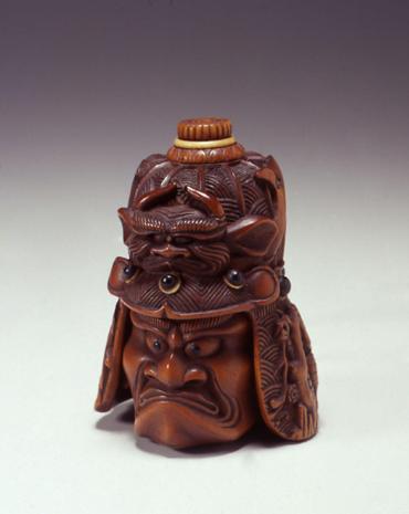 Netsuke: warrior and helmet