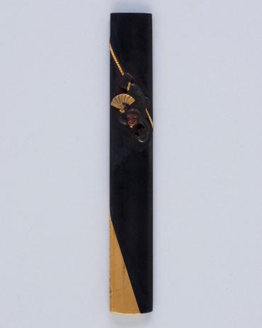 Kozuka: (front) Monkey (Saru) Performing on a Tightrope; (back) poem