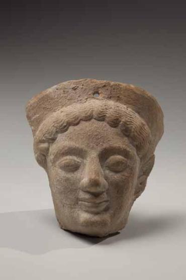 Fragment of a votive protome: Head of a goddess wearing a polos