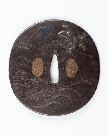 Sword Guard (Tsuba): (front) Mount Fuji and Falcon with Waves below; (back) Eggplant with Waves below