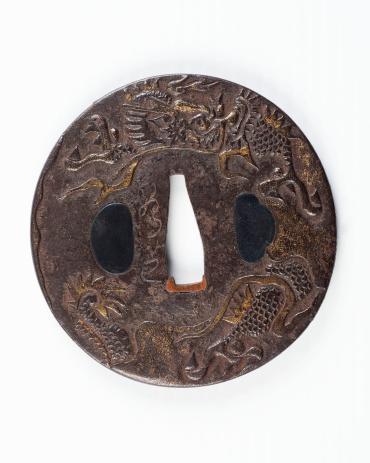 Sword Guard (Tsuba): (front) dragon amid flames and clouds; (back) clouds, flames, and a glimpse of the dragon's body