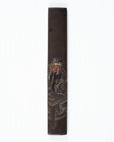 Kozuka: (front) Chinese Figure at Table with Scroll; (back) signature and seal