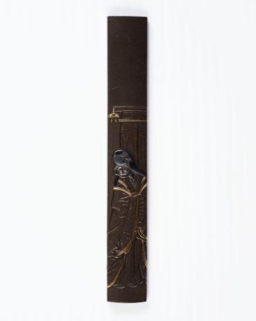 Kozuka: (front) Okame in Front of a Curtain; (back) signature