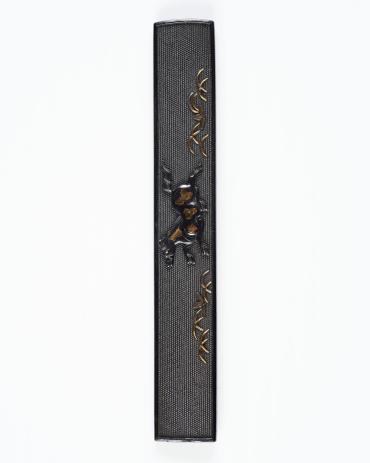 Kozuka: (front) Grass and Galloping Horse; (back) diagonal inlays of shakudo and shibuichi with an inscription