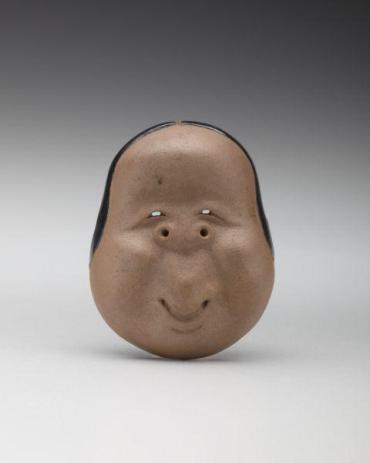 Netsuke: Mask of Okame