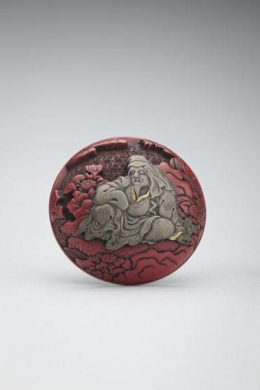 Netsuke: Sage in silver