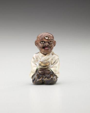 Netsuke: Three-eyed goblin with articulated head and tongue
