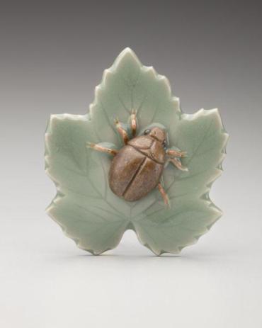 Netsuke: Beetle on maple leaf