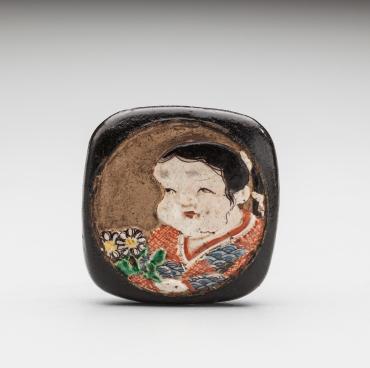 Netsuke: Square manjû of Okame