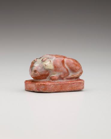 Netsuke: Recumbent boar on a pedestal