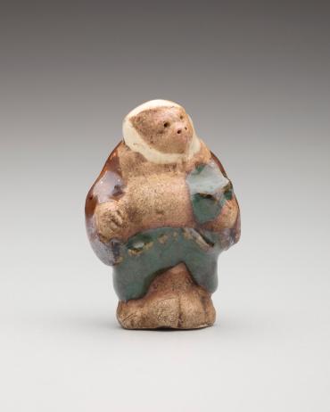 Netsuke: Tanuki in peasant's clothes