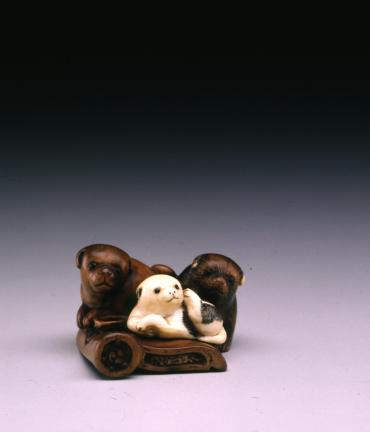 Netsuke: Three Puppies on a Roof Tile