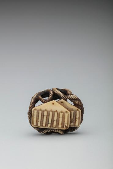 Lace-carved, Round Netsuke (Ryūsa-netsuke 柳左根付) with Wooden Clacker (Naruko 鳴子)