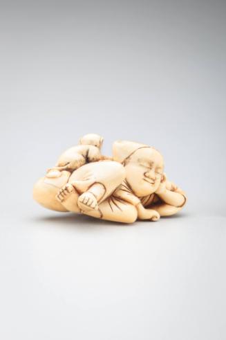 Netsuke: monkey trainer asleep with monkey