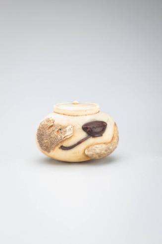 Netsuke:  Bunbuku Chagamma on a Teapot