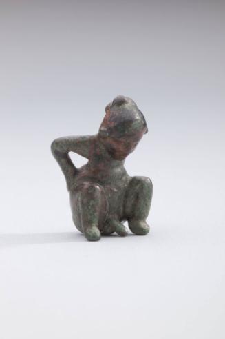 Squatting Male Figure with Hands on Hips