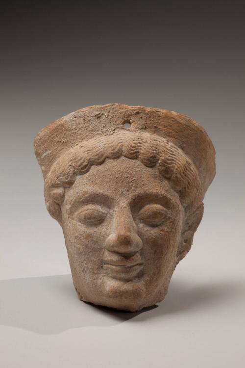 Fragment of a votive protome: Head of a goddess wearing a polos