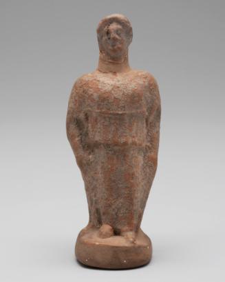 Standing woman (votary?) wearing peplos