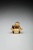 Seated Karako (child) at desk practicing calligraphy