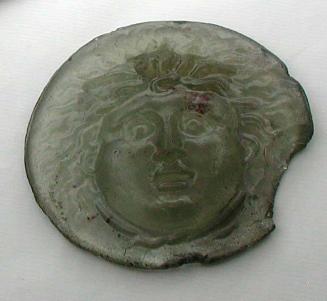 Medallion with molded Medusa head