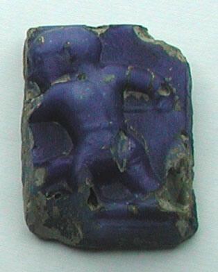 Fragment of molded plaque with pygmy