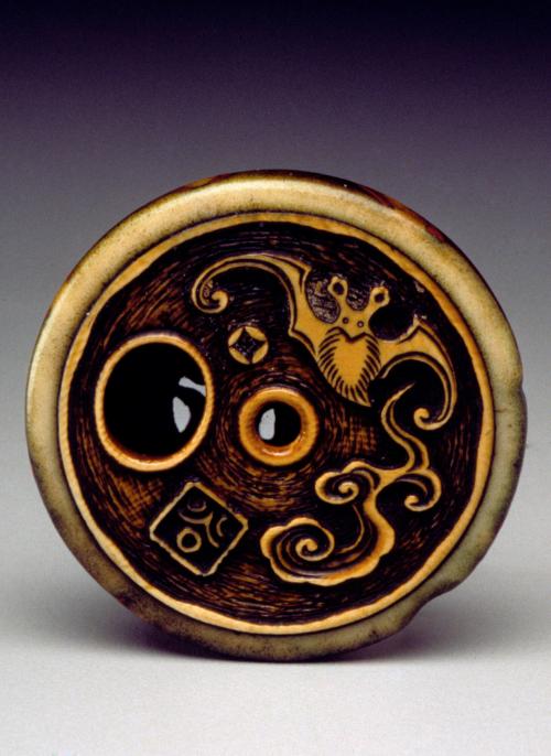 Netsuke: ryusa netsuke of a bat, wave, fan, yak tail, scroll, and mushroom