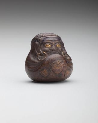 Netsuke: Daruma with gold eyes