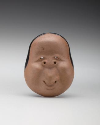 Netsuke: Mask of Okame