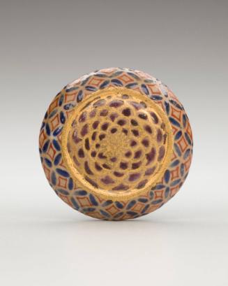 Netsuke: Manjû in the form of a stylized chrysanthemum