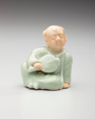 Netsuke: Seated karako child holding a fan