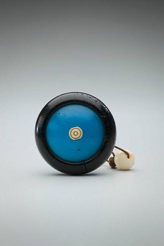 Netsuke: black persimmon with blue glass and ivory