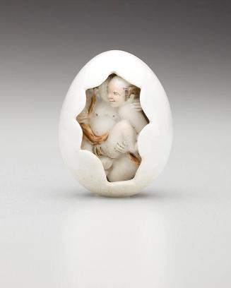 Netsuke: Amorous couple and octopus inside cracked eggshell