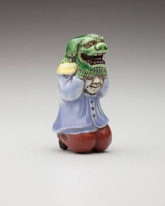 Netsuke: Shishimai child dancer lifting a lion mask (green mask)