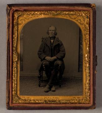 Full-length Portrait of a Man Seated in a Chair