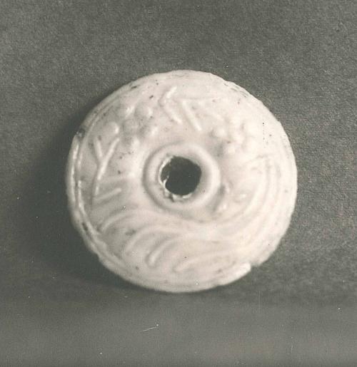 Disk with Deer (?) and Floral Relief