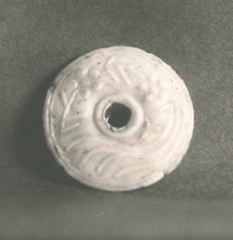 Disk with Deer (?) and Floral Relief